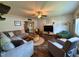 Open-concept living room with wood floors, ceiling fan, and plenty of seating at 148 Langston Ridge Dr Dr, Angier, NC 27501