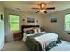 Comfortable bedroom with natural light, ceiling fan, and hardwood floors at 148 Langston Ridge Dr Dr, Angier, NC 27501