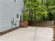 The back patio is concrete and features a set of stairs leading to the backyard at 15 Gray Fox Ct, Durham, NC 27713