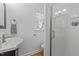 Bathroom with modern sink, a glass-enclosed shower, and window with blinds at 15 Gray Fox Ct, Durham, NC 27713