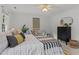 Bedroom featuring modern decor and furnishings, carpet, ceiling fan and large windows with blinds at 15 Gray Fox Ct, Durham, NC 27713