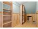 Bonus closet featuring custom wood shelving and additional storage at 15 Gray Fox Ct, Durham, NC 27713