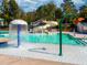 Recreational waterpark pool featuring a water slide and a splash fountain at 15 Gray Fox Ct, Durham, NC 27713