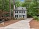 Charming two-story home with a well-maintained lawn and a long driveway at 15 Gray Fox Ct, Durham, NC 27713