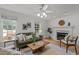 Cozy living room features a fireplace, hardwood floors, and lots of natural light at 15 Gray Fox Ct, Durham, NC 27713