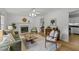 Inviting living room with a fireplace, natural light, and comfortable seating arrangement at 15 Gray Fox Ct, Durham, NC 27713
