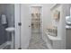 Welcoming hallway featuring a powder room, mudroom and bench seating for added convenience at 157 Vaughan Farms Drive Dr, Angier, NC 27501