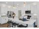 Modern kitchen with white cabinetry, stainless steel appliances, and a spacious island with bar seating at 157 Vaughan Farms Drive Dr, Angier, NC 27501