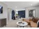 Spacious and stylish living room featuring a plush sectional sofa and modern decor at 157 Vaughan Farms Drive Dr, Angier, NC 27501