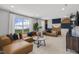 Spacious living room featuring a comfortable sectional sofa, a patterned accent wall, and bright natural light at 157 Vaughan Farms Drive Dr, Angier, NC 27501