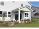 Inviting outdoor patio with stylish seating and a well-maintained yard, ideal for relaxation and entertaining at 157 Vaughan Farms Drive Dr, Angier, NC 27501