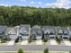 An aerial view highlighting the home's location within a community with beautiful green tree coverage at 167 Monteith Dr, Chapel Hill, NC 27516