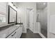Modern bathroom featuring a glass-enclosed shower and a sleek vanity with a large mirror at 167 Monteith Dr, Chapel Hill, NC 27516