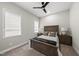 Comfortable bedroom with neutral walls, carpet, ceiling fan, and a cozy queen-sized bed at 167 Monteith Dr, Chapel Hill, NC 27516