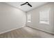 Empty bedroom with carpet, ceiling fan, neutral walls, and lots of natural light from the windows at 167 Monteith Dr, Chapel Hill, NC 27516