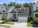 Charming two-story home with a well-manicured front yard and attached garage at 167 Monteith Dr, Chapel Hill, NC 27516