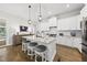 Gourmet kitchen features a marble island, pendant lighting, and stainless steel appliances at 167 Monteith Dr, Chapel Hill, NC 27516