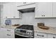Gourmet kitchen features stainless steel appliances, granite countertops, and stylish white subway tile backsplash at 167 Monteith Dr, Chapel Hill, NC 27516