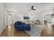 Elegant living room features hardwood floors, neutral paint, and lots of comfortable seating at 167 Monteith Dr, Chapel Hill, NC 27516