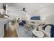 Spacious living room boasts a cozy fireplace, hardwood floors, and ample seating at 167 Monteith Dr, Chapel Hill, NC 27516