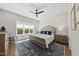 Inviting main bedroom suite features a ceiling fan, large window, and a luxurious rug at 167 Monteith Dr, Chapel Hill, NC 27516