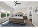 Inviting main bedroom suite features a ceiling fan, large window, and a luxurious rug at 167 Monteith Dr, Chapel Hill, NC 27516
