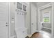 Well-organized mud room featuring built-in storage, seating, and convenient access to laundry area at 167 Monteith Dr, Chapel Hill, NC 27516