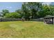 Fenced backyard featuring play area, green lawn, and gazebo at 169 Forest Dr, Graham, NC 27253