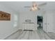 Neutral bedroom with a ceiling fan, hard surface floors, and decorative dresser at 169 Forest Dr, Graham, NC 27253