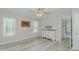 Bright bedroom featuring hard surface floors, modern windows, and a neutral color scheme at 169 Forest Dr, Graham, NC 27253
