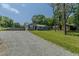 View of the home, driveway, and surrounding landscape at 169 Forest Dr, Graham, NC 27253