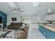 Open-concept living area with a modern color scheme, skylights, and stylish decor at 169 Forest Dr, Graham, NC 27253
