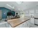 Open floor plan showcasing the living room, skylights, vaulted ceilings, and kitchen area at 169 Forest Dr, Graham, NC 27253