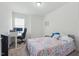 Bright bedroom features a well-lit desk area and comfortable furnishings, creating a functional and inviting space at 187 Harpers Landing Rd, Garner, NC 27529