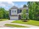 Attractive two-story home featuring a manicured lawn and a convenient two-car garage at 187 Harpers Landing Rd, Garner, NC 27529