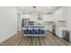Contemporary kitchen featuring a stylish island, modern appliances, and sleek white cabinetry at 187 Harpers Landing Rd, Garner, NC 27529