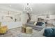 Open-concept living area showcasing modern furnishings and seamless flow to other living spaces at 187 Harpers Landing Rd, Garner, NC 27529