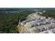 Aerial view showcasing the neighborhood's layout, featuring green space, walking paths, and consistent architectural design at 209 Timber Forest Ln, Cary, NC 27519