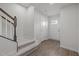 Inviting entryway features wood-look flooring, a staircase to the upper level, and ample natural light at 209 Timber Forest Ln, Cary, NC 27519
