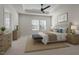 Serene main bedroom with tray ceiling, stylish decor, and plenty of natural light from large windows at 209 Timber Forest Ln, Cary, NC 27519