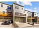 Rear exterior with multiple levels of decks and a drive-under garage for convenient access at 209 Timber Forest Ln, Cary, NC 27519