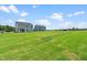 Beautifully kept lawn extends behind the new home at 210 Bluebell St, Sanford, NC 27330