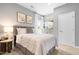 This serene bedroom offers soft lighting and stylish decor at 210 Bluebell St, Sanford, NC 27330