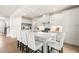 Stylish kitchen featuring a large island, white cabinets, stainless steel appliances, and modern pendant lighting at 210 Bluebell St, Sanford, NC 27330