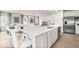 Spacious open-concept kitchen with a large island, stainless steel appliances, and modern fixtures at 210 Bluebell St, Sanford, NC 27330