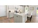 Well-appointed kitchen with a center island, stainless steel appliances, and bright lighting fixtures at 210 Bluebell St, Sanford, NC 27330