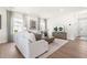 Cozy living room showcases modern decor, warm lighting, and backyard views at 210 Bluebell St, Sanford, NC 27330