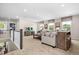 This spacious loft features a bar, comfortable seating, and plenty of natural light at 210 Bluebell St, Sanford, NC 27330