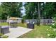 Spacious backyard with patio, grill, outdoor dining area, and shed, perfect for entertaining and relaxation at 212 Southerby Dr, Garner, NC 27529
