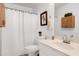 Bathroom featuring white fixtures, cabinet and toilet with shower curtain at 212 Southerby Dr, Garner, NC 27529